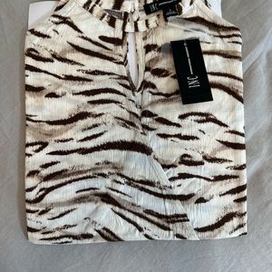 Animal print sleeveless top. Fun and flirty!